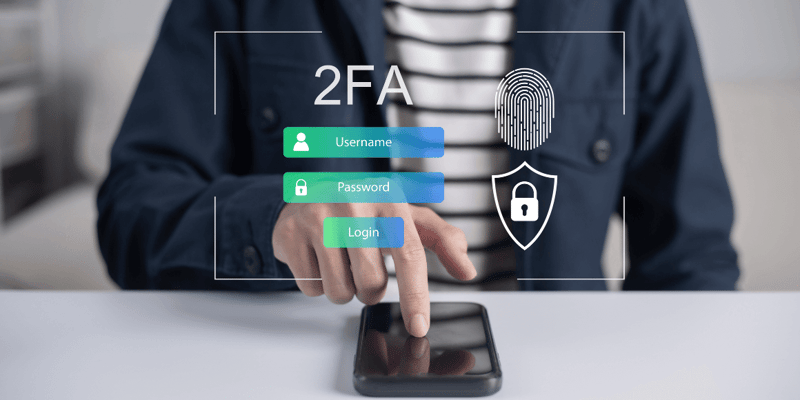 A person pointing at a smartphone with digital security icons and 